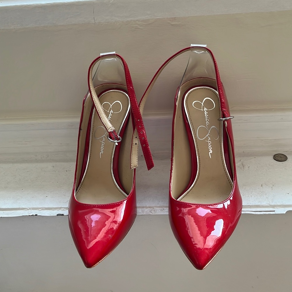 Worn twice. Red pumps